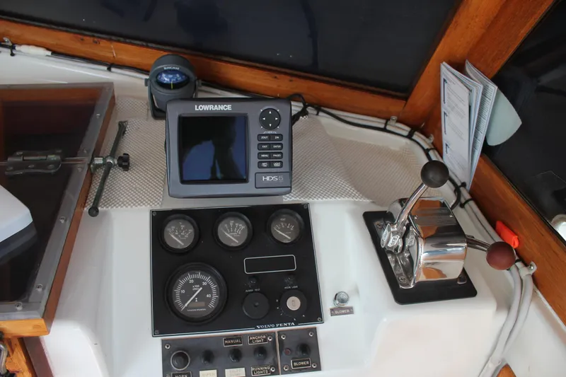 Slide: The Image of 1988 Cape Dory 28 Hardtop helm with Lowrance navigation system and control panel. - 14