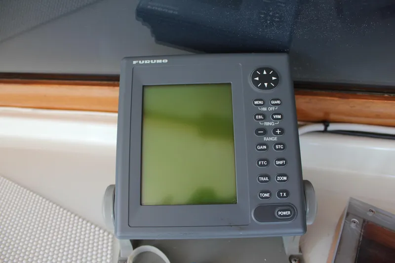 Slide: The Image of Furuno marine navigation device on 1988 Cape Dory 28 Hardtop boat dashboard. - 17