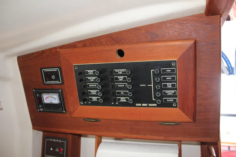 Slide: The Image of Control panel of a 1988 Cape Dory 28 Hardtop yacht with various switches and gauges. - 19