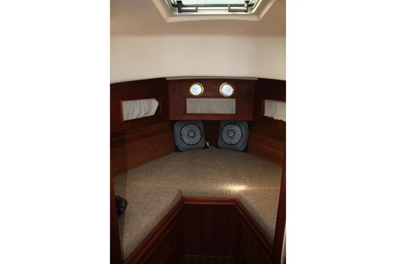 Slide: The Image of Interior cabin of 1988 Cape Dory 28 Hardtop with cozy bedding and portholes. - 20