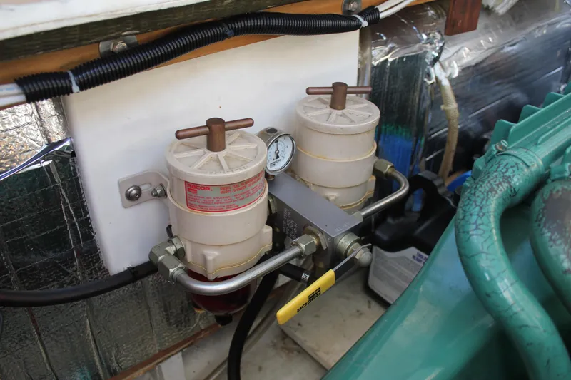 Slide: The Image of Fuel filter system in a 1988 Cape Dory 28 Hardtop boat engine compartment. - 29