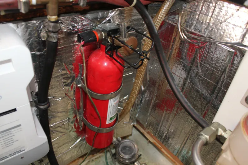Slide: The Image of Fire extinguisher in 1988 Cape Dory 28 Hardtop engine room with reflective insulation. - 30