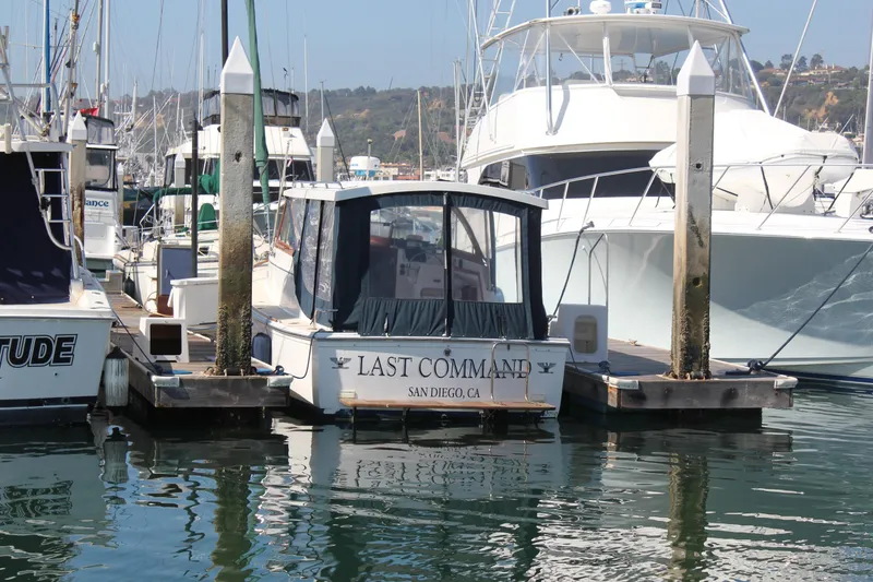 Slide: The Image of 1988 Cape Dory 28 Hardtop boat named "Last Command" docked in San Diego marina. - 31