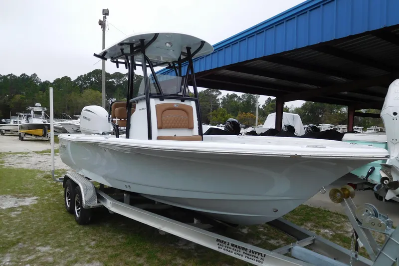Slide: The Image of 2026 Sea Hunt BX 22 BR boat on trailer under blue canopy. - 3