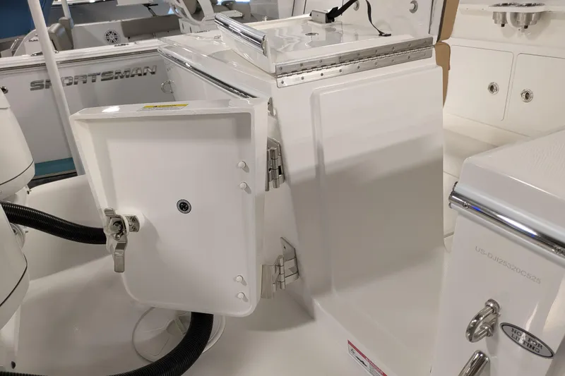 Slide: The Image of 2025 Regulator 25 boat interior with open storage compartment and sleek design. - 25