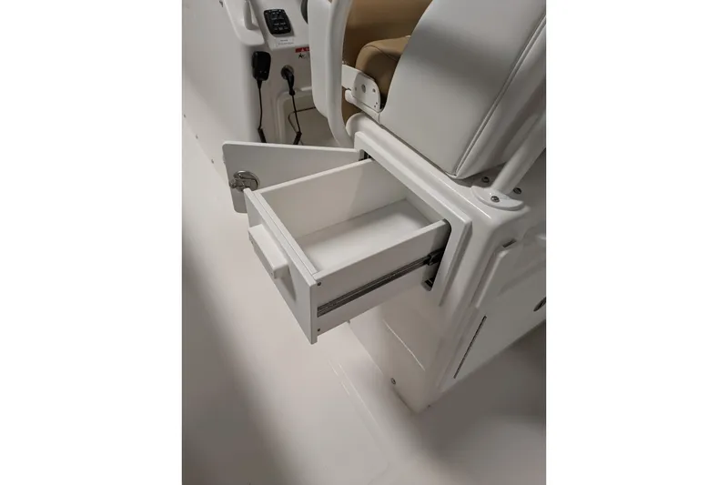 Slide: The Image of Open storage drawer on 2025 Regulator 25 boat, showcasing sleek design and functionality. - 31