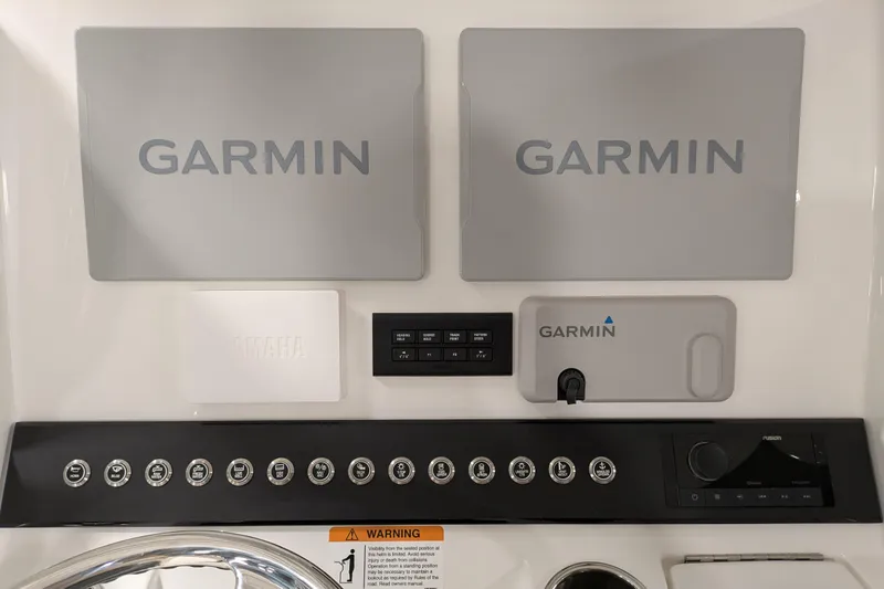 Slide: The Image of Control panel of 2025 Regulator 25 boat featuring Garmin electronics. - 36
