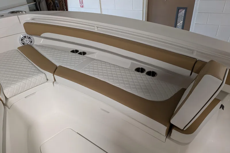 Slide: The Image of Luxurious seating on 2025 Regulator 25 boat with diamond-stitched upholstery and cup holders. - 39