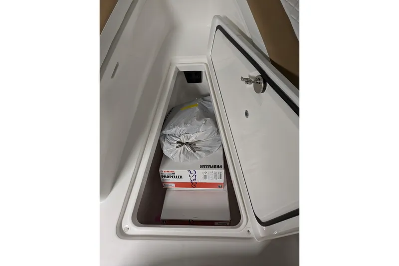 Slide: The Image of Storage compartment of 2025 Regulator 25 boat with Yamaha propeller box. - 41