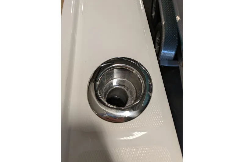 Slide: The Image of Close-up of a 2025 Regulator 25 boat's stainless steel cup holder. - 55
