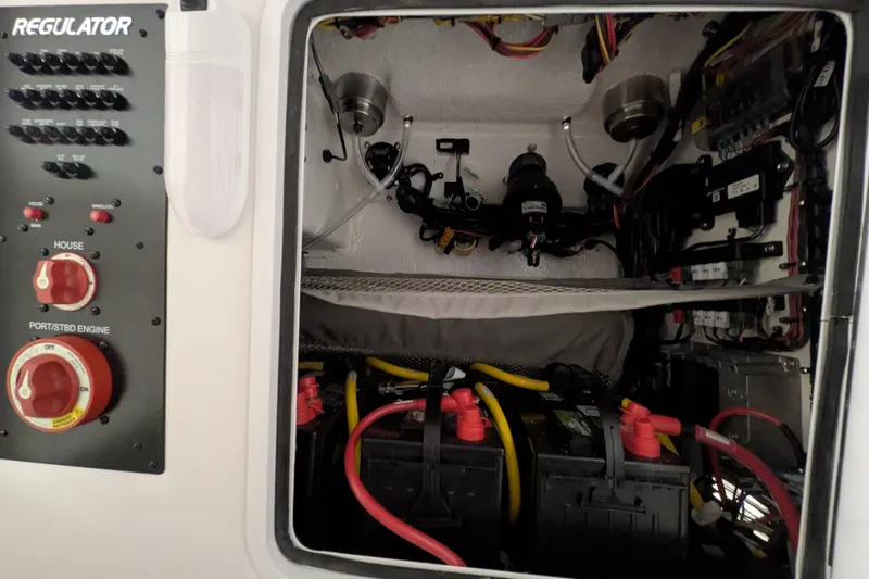 Slide: The Image of Electrical panel and battery compartment of 2025 Regulator 25 boat. - 62