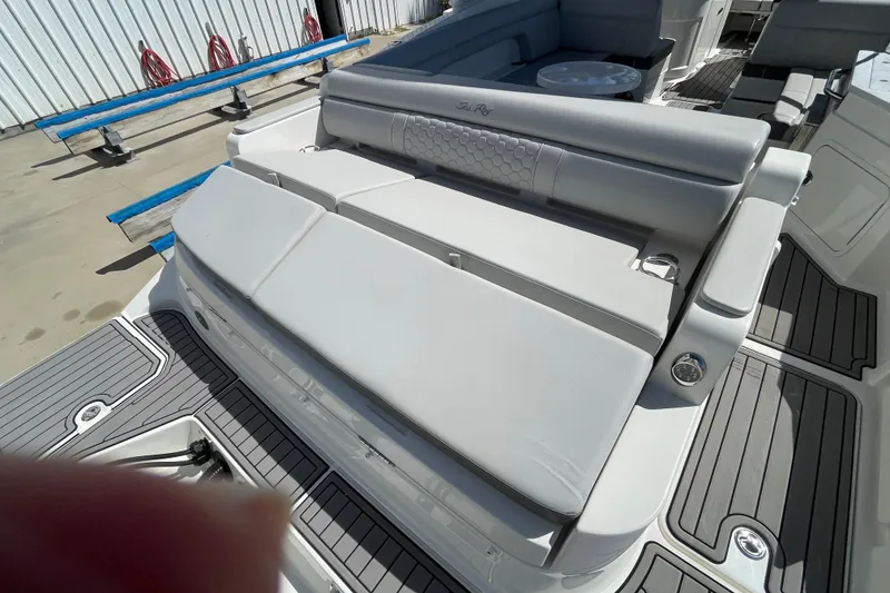 Slide: The Image of 2023 Sea Ray SDX 290 Outboard boat interior with cushioned seating and sleek design. - 12