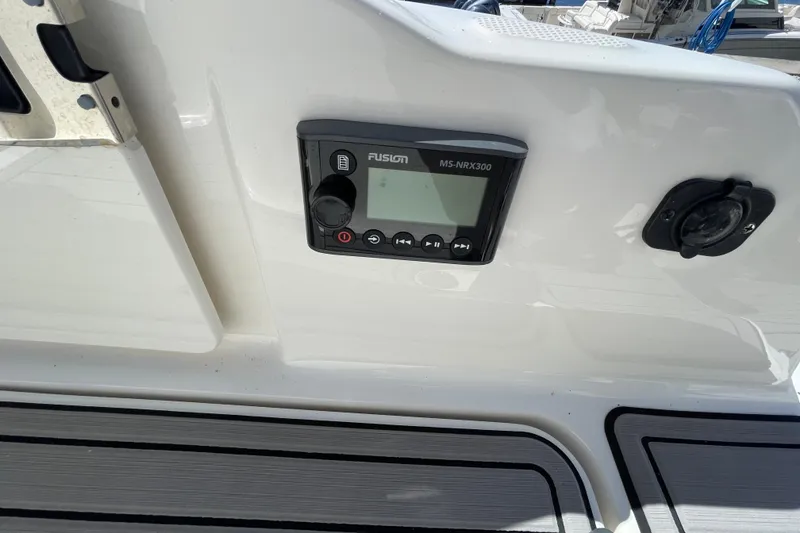 Slide: The Image of Control panel on 2023 Sea Ray SDX 290 Outboard boat deck. - 16