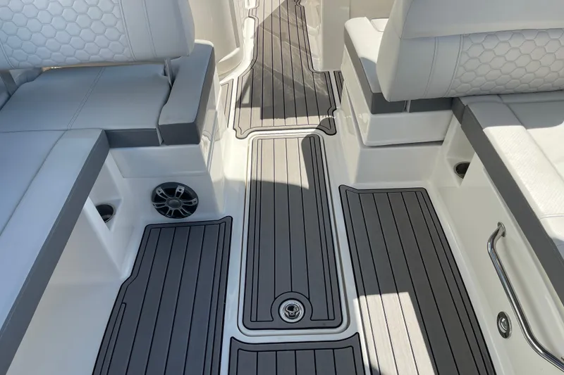 Slide: The Image of 2023 Sea Ray SDX 290 Outboard interior with sleek seating and modern flooring design. - 18
