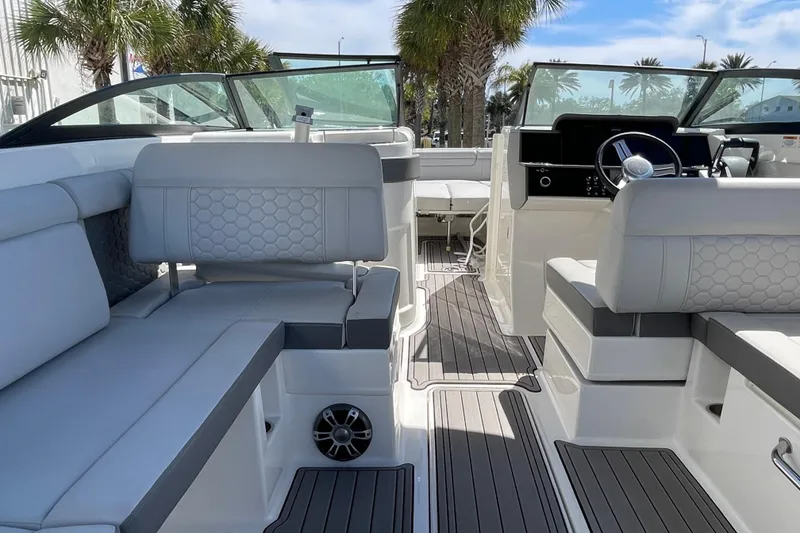 Slide: The Image of 2023 Sea Ray SDX 290 Outboard interior with luxurious seating and modern dashboard. - 21