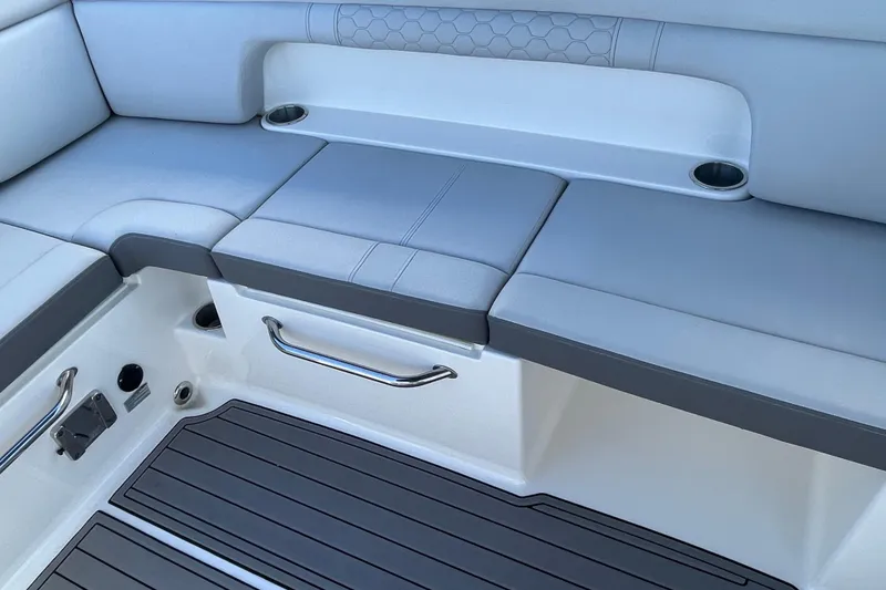 Slide: The Image of 2023 Sea Ray SDX 290 Outboard interior seating with cup holders and sleek design. - 29