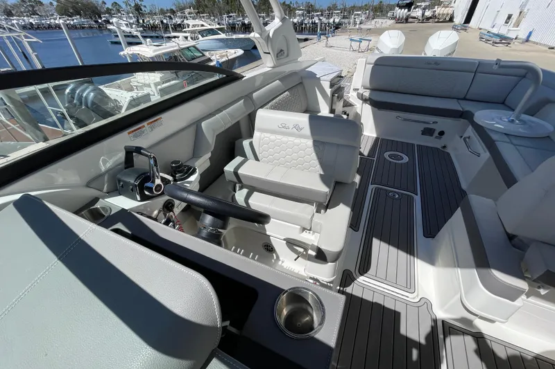 Slide: The Image of 2023 Sea Ray SDX 290 Outboard boat interior with luxurious seating and modern controls. - 31