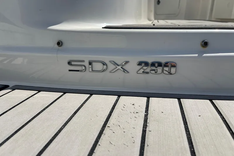 Slide: The Image of 2023 Sea Ray SDX 290 Outboard boat emblem on deck. - 36