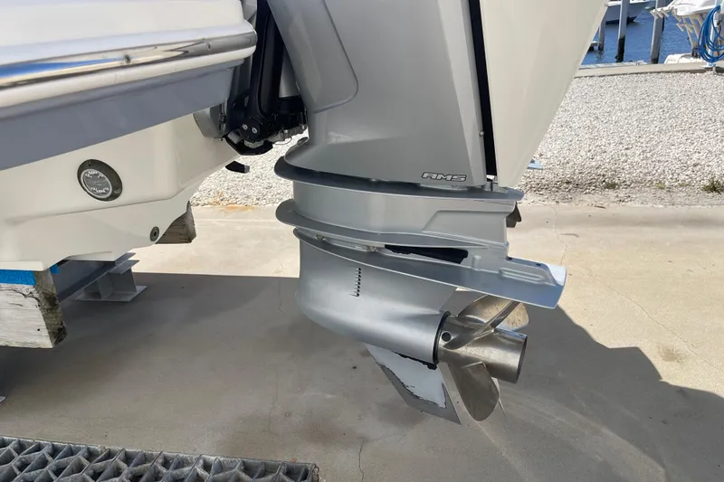 Slide: The Image of 2023 Sea Ray SDX 290 Outboard engine close-up, showcasing propeller and lower unit. - 37