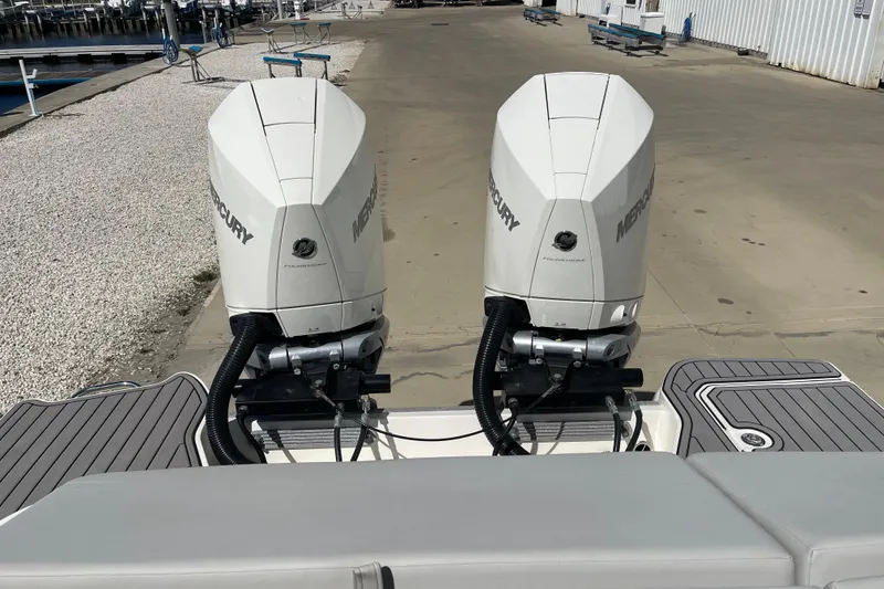 Slide: The Image of 2023 Sea Ray SDX 290 Outboard with twin Mercury engines at dockside. - 38