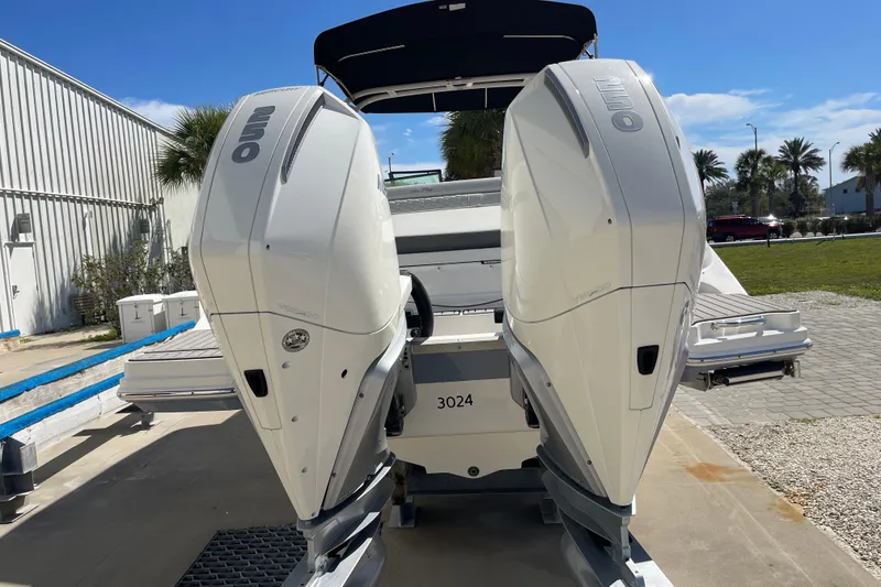 Slide: The Image of 2023 Sea Ray SDX 290 Outboard with dual engines, parked outdoors on a sunny day. - 39