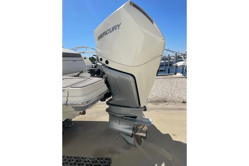 Slide: The Image of 2023 Sea Ray SDX 290 Outboard with Mercury engine, docked under clear blue sky. - 40