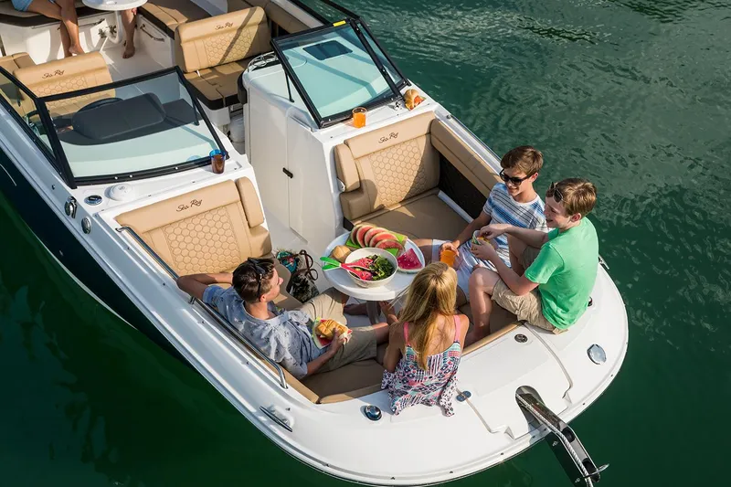 Slide: The Image of Manufacturer Provided Image: 2023 Sea Ray SDX 290 Outboard boat with people enjoying a meal on deck. - 42