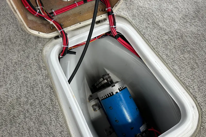 Slide: The Image of Open compartment of 2012 ElectraCraft CAT 16 showing motor and wiring. - 12