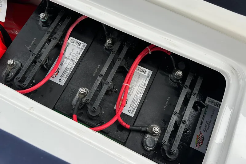 Slide: The Image of Battery compartment of a 2012 ElectraCraft CAT 16 with visible wiring connections. - 13