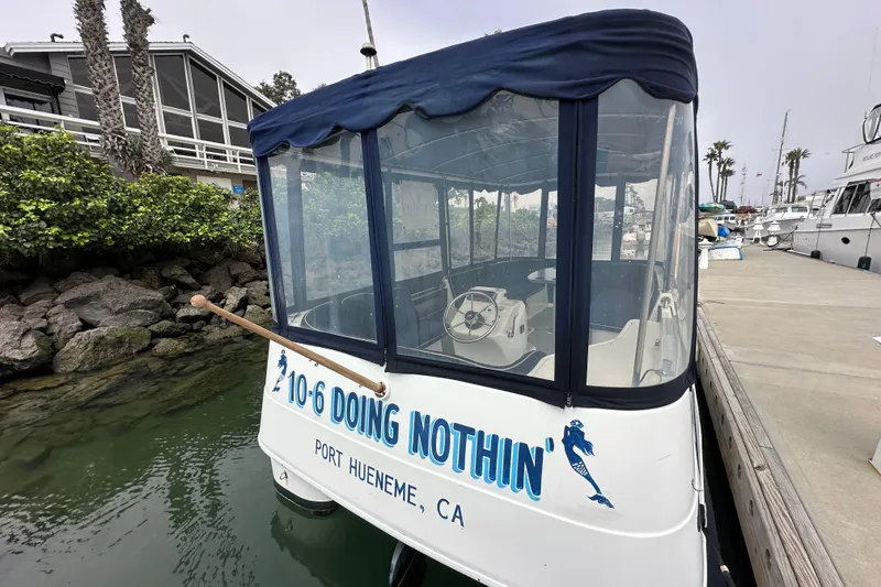 Slide: The Image of ElectraCraft CAT 16 boat docked in Port Hueneme, CA, with enclosed canopy. - 5