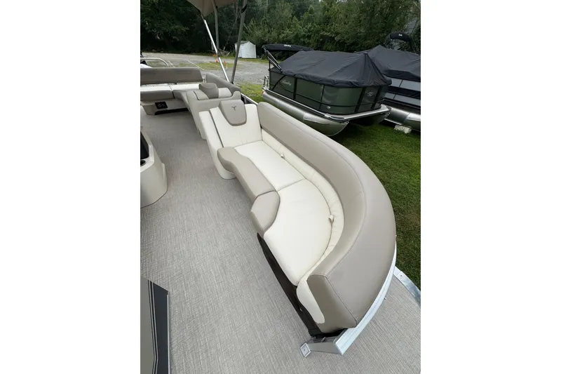 Slide: The Image of 2026 Tahoe Pontoon LTZ CRB with luxurious beige seating on display. - 4