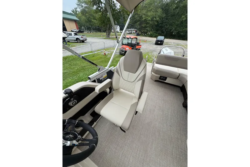 Slide: The Image of 2026 Tahoe Pontoon LTZ CRB interior with luxurious seating and modern steering wheel. - 5