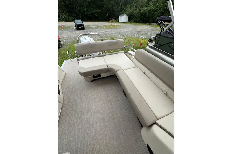 Slide: The Image of 2026 Tahoe Pontoon LTZ CRB interior with beige seating and spacious layout. - 7
