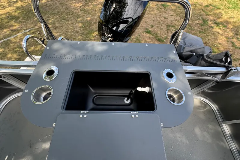 Slide: The Image of 2026 Tahoe Pontoon Sport 85 Center Console Fish 23 with fishing station and rod holders. - 13