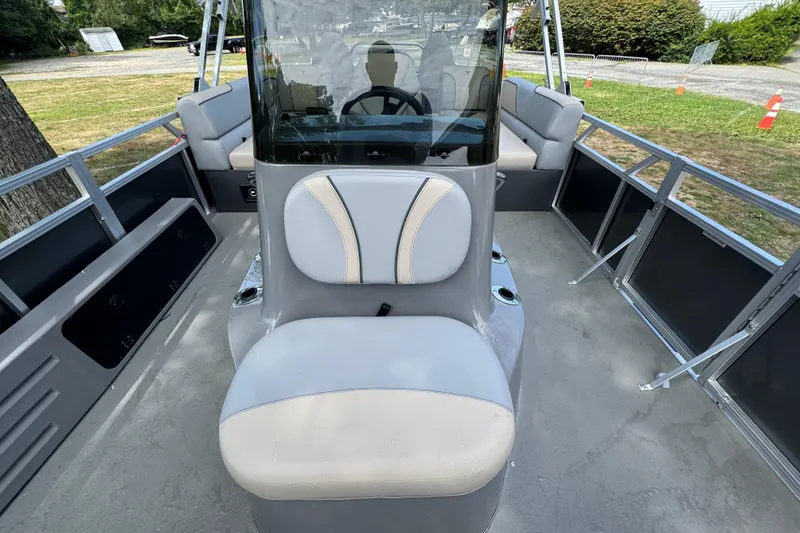 Slide: The Image of 2026 Tahoe Pontoon Sport 85 Center Console Fish 23 interior with seating and steering console. - 4