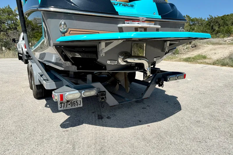 Slide: The Image of 2016 Nautique Super Air Nautique G23 boat on trailer, rear view. - 14