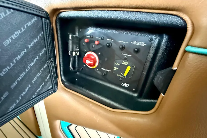 Slide: The Image of Control panel of a 2016 Nautique Super Air Nautique G23 boat interior. - 33