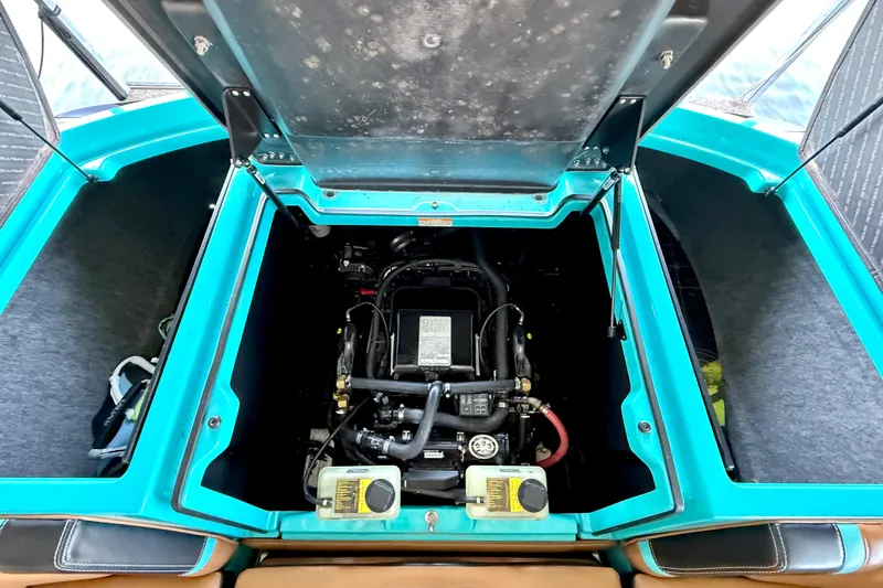 Slide: The Image of Engine compartment of 2016 Nautique Super Air Nautique G23 boat, open hatch view. - 35