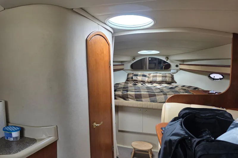 Slide: The Image of Interior of 2000 Cruisers Yachts 3375 Express with cozy cabin and bed. - 7