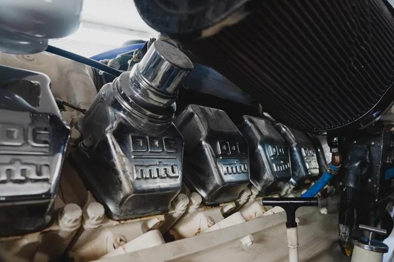 Slide: The Image of Engine components of a 1999 Viking 58 Convertible yacht, featuring MTU branding. - 102