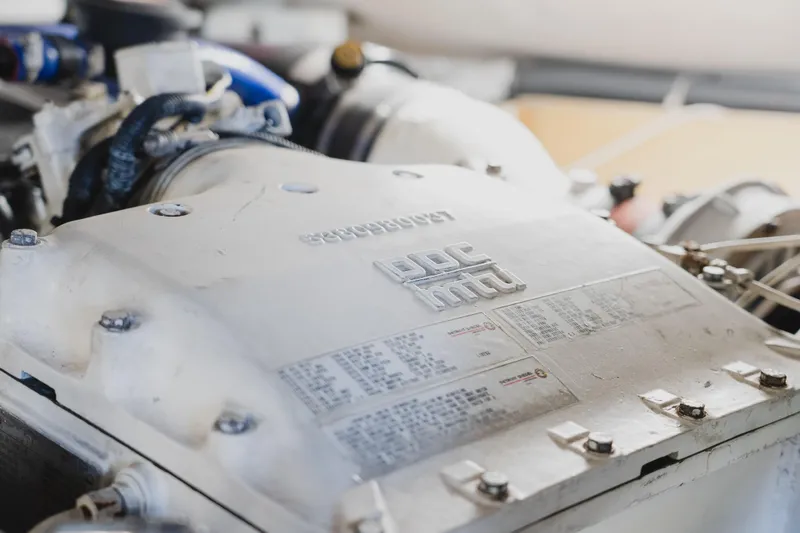 Slide: The Image of Close-up of a 1999 Viking 58 Convertible engine component with visible specifications. - 105