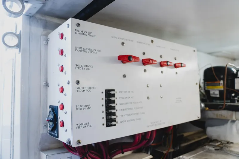 Slide: The Image of Electrical panel on a 1999 Viking 58 Convertible boat, featuring various circuit controls. - 109