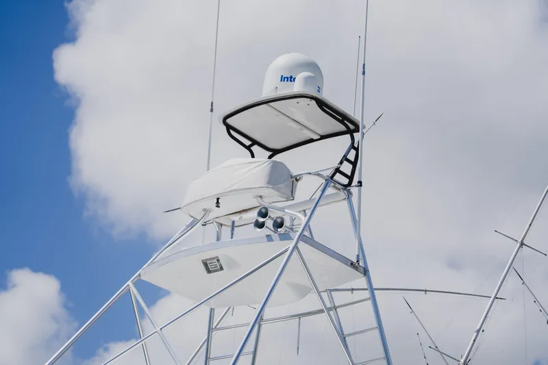 Slide: The Image of Radar tower on 1999 Viking 58 Convertible yacht against cloudy sky. - 20