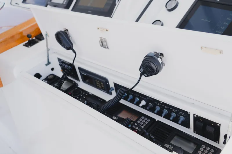 Slide: The Image of Control panel of a 1999 Viking 58 Convertible yacht with communication equipment. - 30