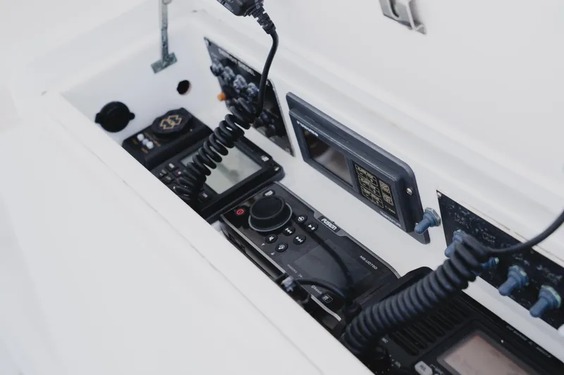 Slide: The Image of Control panel of a 1999 Viking 58 Convertible yacht with communication devices. - 31