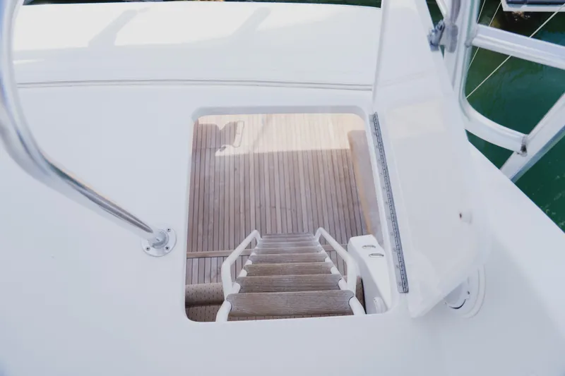 Slide: The Image of Staircase on 1999 Viking 58 Convertible yacht, leading to wooden deck. - 34