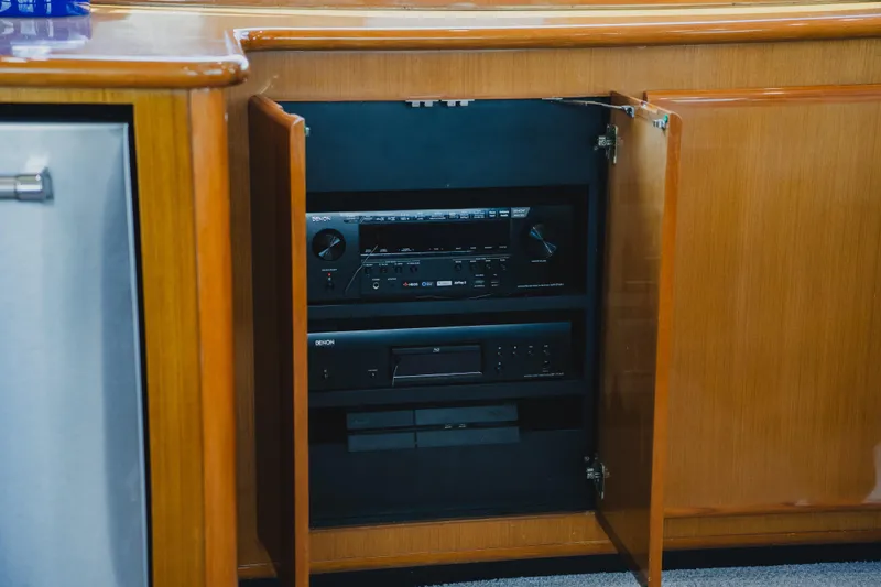 Slide: The Image of Audio equipment inside wooden cabinet on 1999 Viking 58 Convertible yacht. - 48