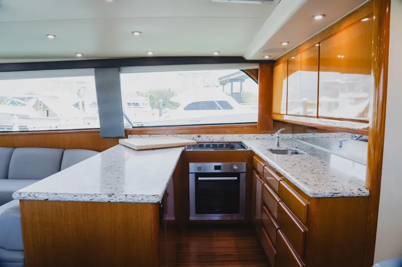 Slide: The Image of Luxurious kitchen interior of 1999 Viking 58 Convertible yacht with modern appliances. - 50