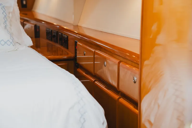 Slide: The Image of Luxurious wooden cabinetry in 1999 Viking 58 Convertible yacht interior bedroom. - 71