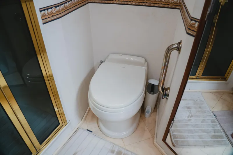 Slide: The Image of Luxury bathroom on 1999 Viking 58 Convertible yacht with elegant fixtures. - 76